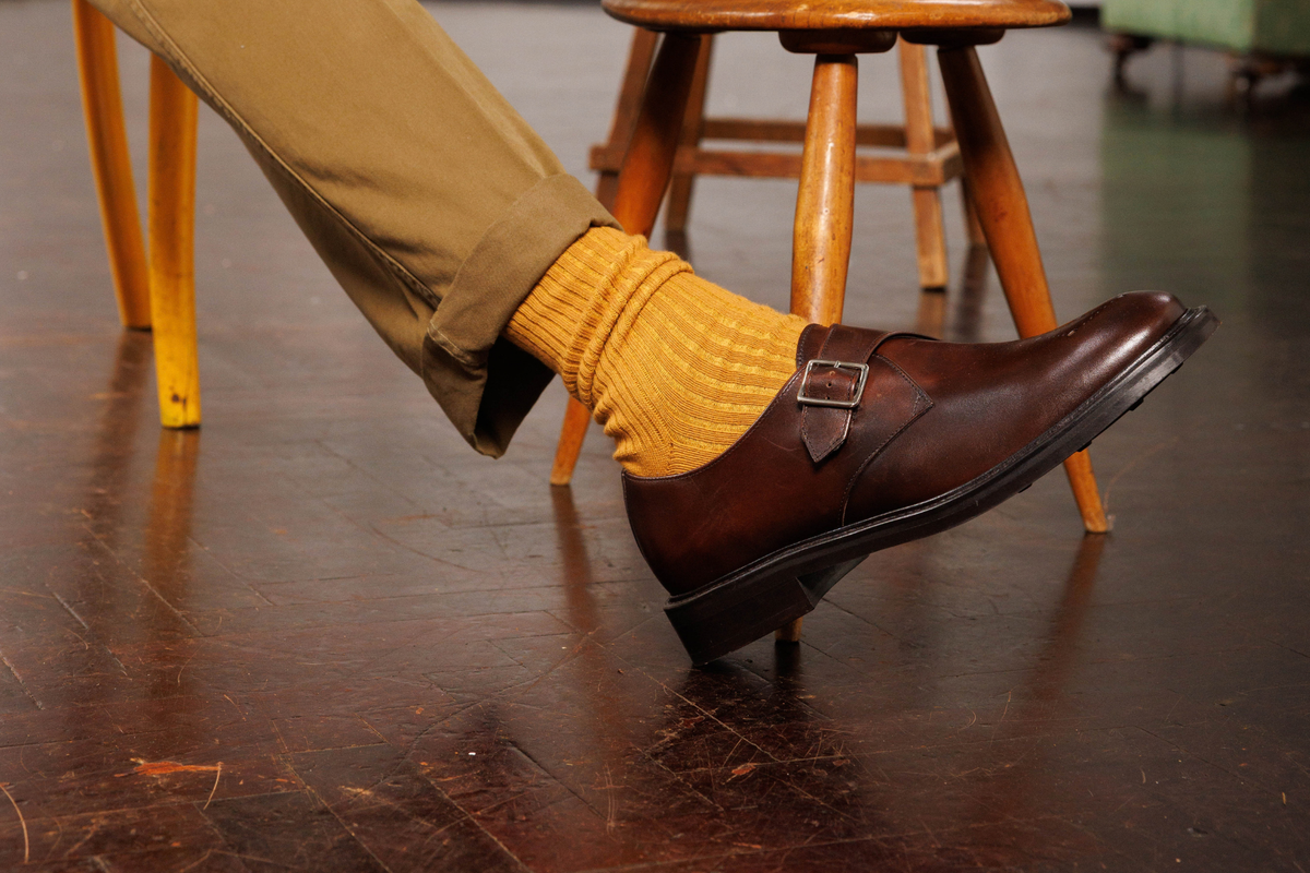 Wildsmith Model 120 monk-strap shoe in Dark Brown Calf, worn with mustard socks and chinos