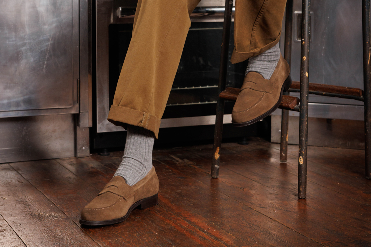 Wildsmith Model 31 penny loafers in Dark Taupe Suede, worn with grey socks and chinos