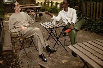 Men drinking coffee outside